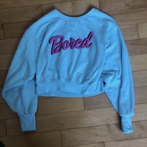 Garage scoop neck sweater that says bored